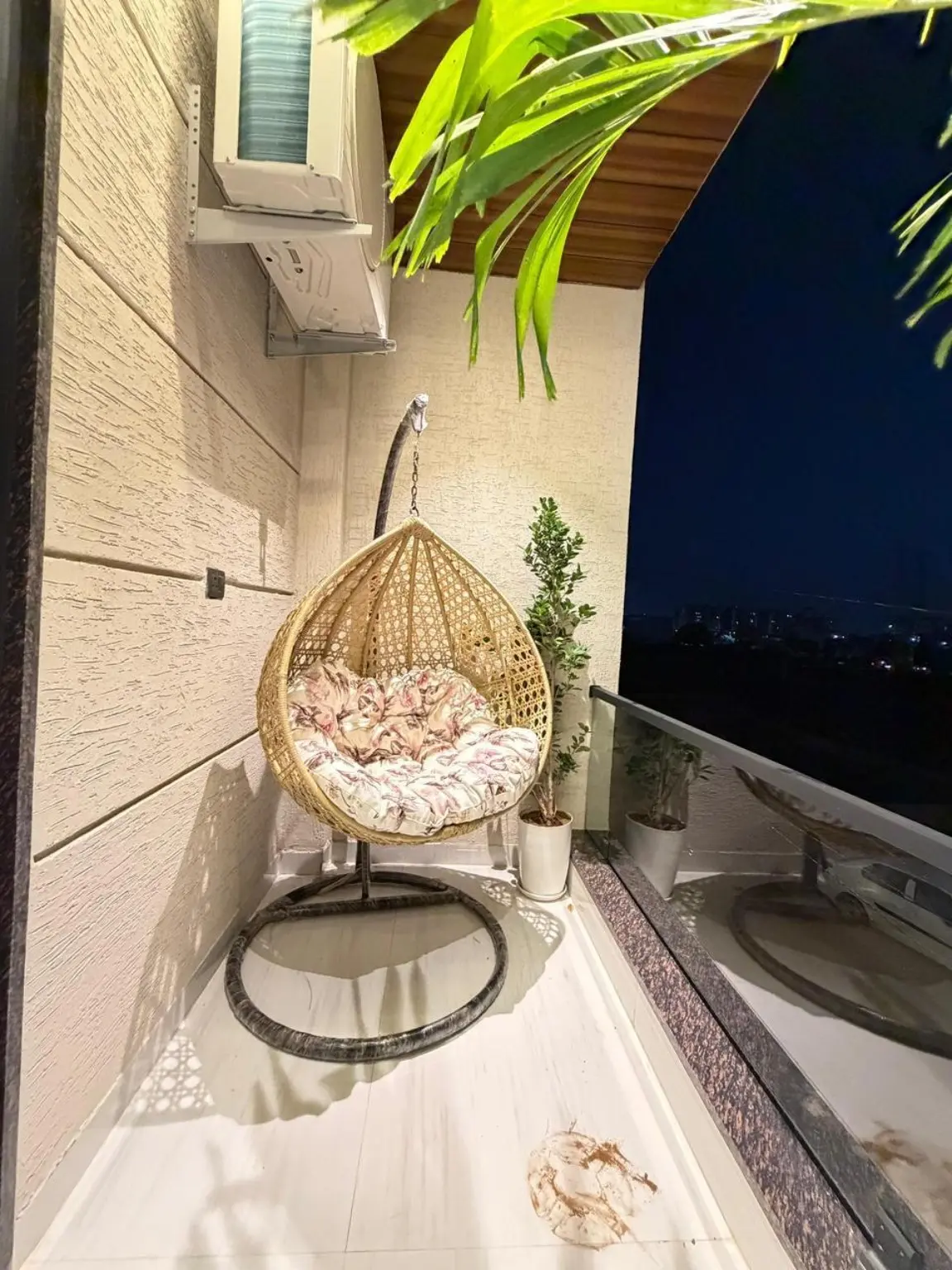 Private landscaped balcony at night